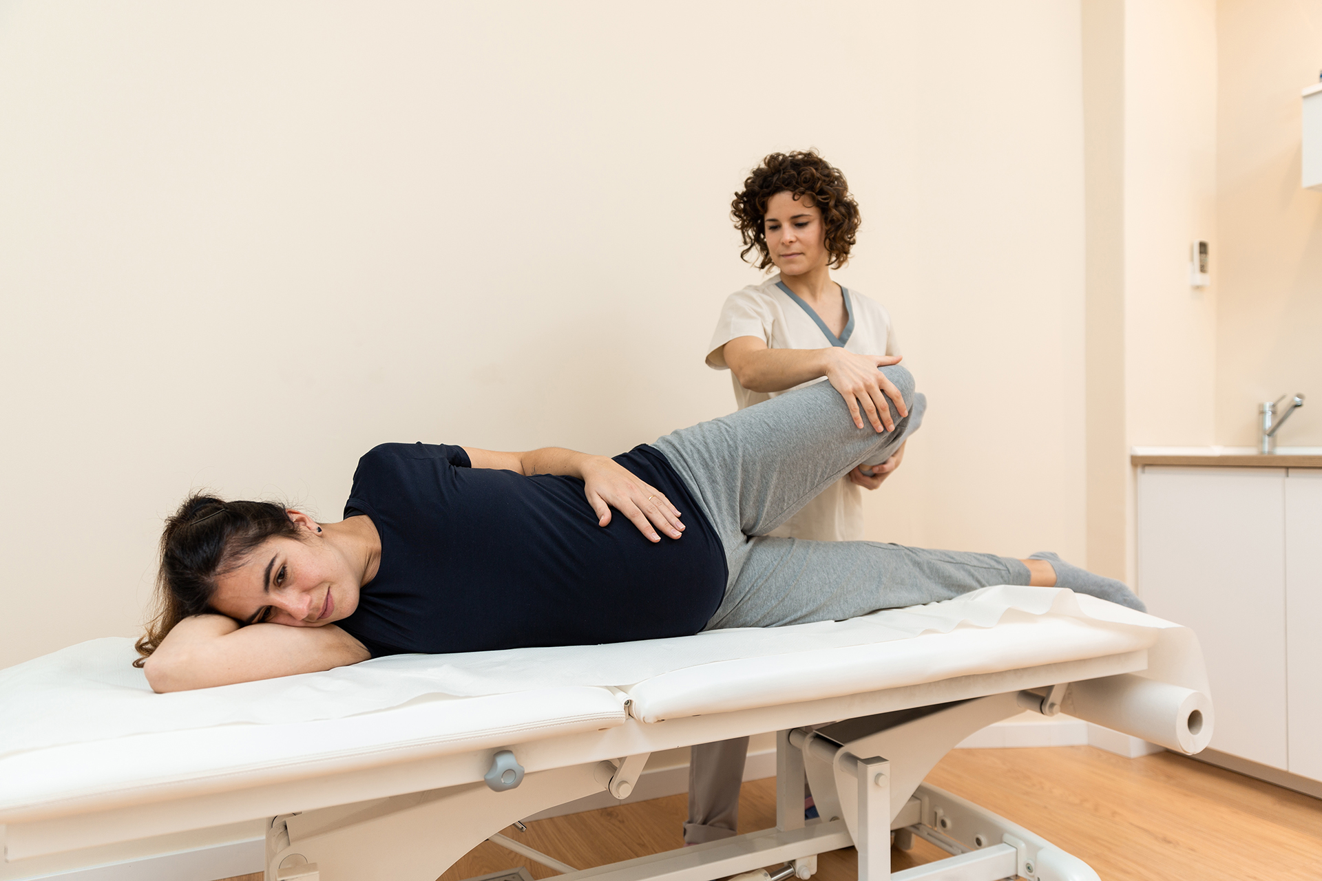 woman receives leg massage at physical therapy